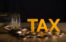 Tax-Buchstaben auf Kleingeld