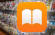 Der Screenshot zeigt das Symbol der Apple-Anwendung «Bücher»; im Hintergrund sieht man einen unscharfen Zeitschriftenstand
