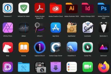 Der Screenshot zeigt viele verschiedene Symbole von Mac-Programmen auf schwarzem Hintergrund